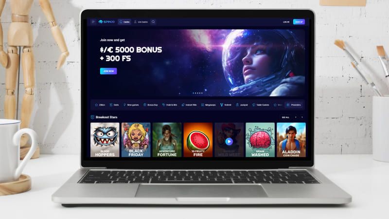 Spinjo Casino hovedside på den bærbare computerskærm