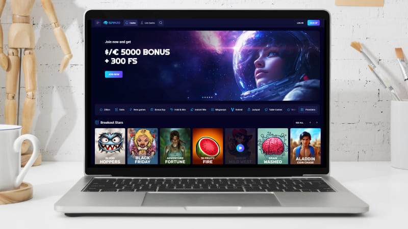 Spinjo Casino hovedside på notebook-skærmen